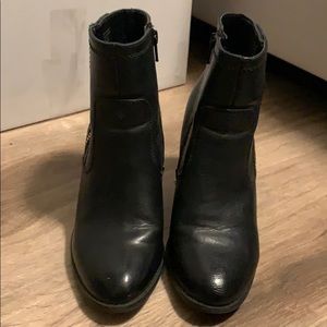 A black with gold zipper detailing booties